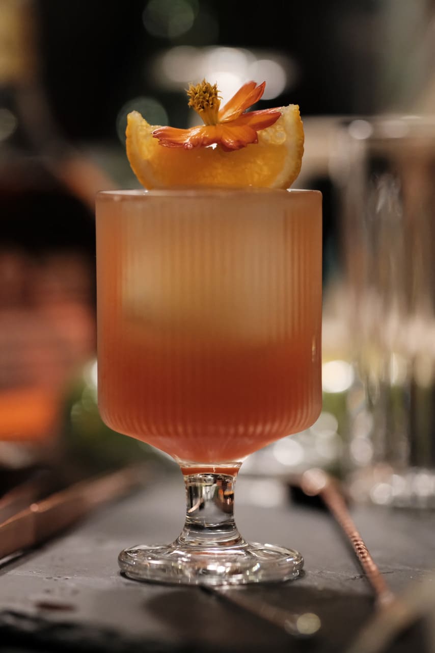 An amber cocktail on the table