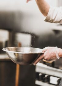 Chef salting a dish
