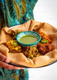Women holding an African food platter